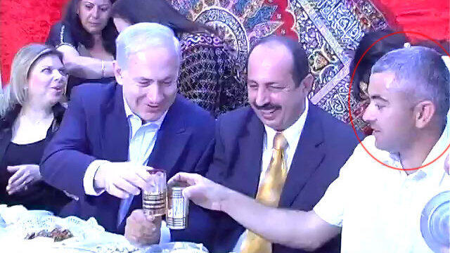Electrician Avi Fahima sitting with Netanyahunullnull Electrician Avi Fahima sitting with Netanyahu
