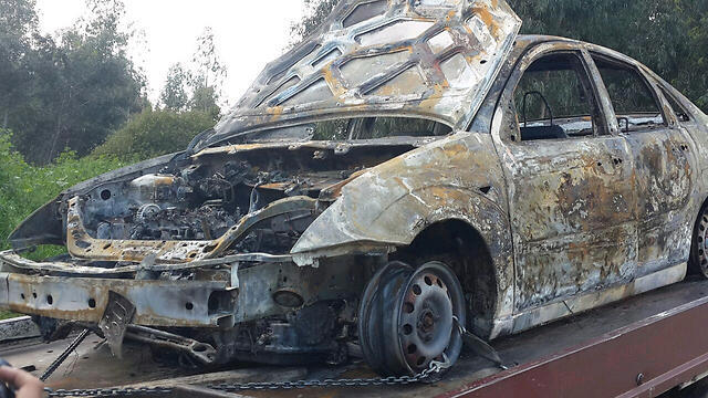 The torched car.nullnull The torched car.