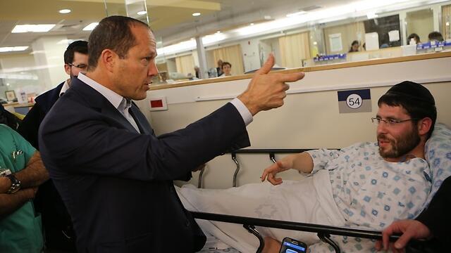 Jerusalem Mayor Barkat meets with stabbing victim. (Photo: Alex Kolomoisky)