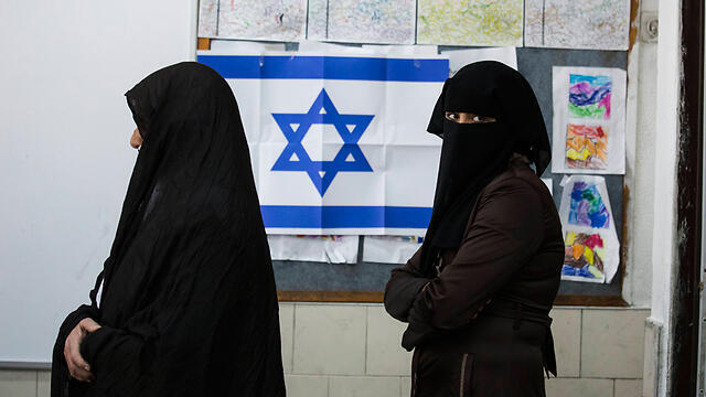 Israeli Arabs are caught in a crossfire between politicians who are competing over ‘who will harm the Arabs more’ (Photo: AP) (צילום: AP) Israeli Arabs are caught in a crossfire between politicians who are competing over ‘who will harm the Arabs more’ (Photo: AP)