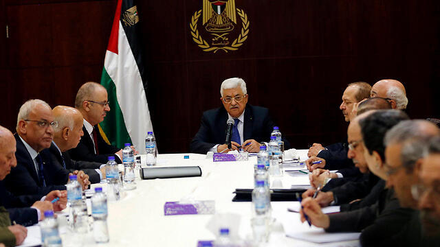 The Palestinian government with Abbas at its head in Ramallah. (Photo: Reuters) (צילום: רויטרס) The Palestinian government with Abbas at its head in Ramallah. (Photo: Reuters)