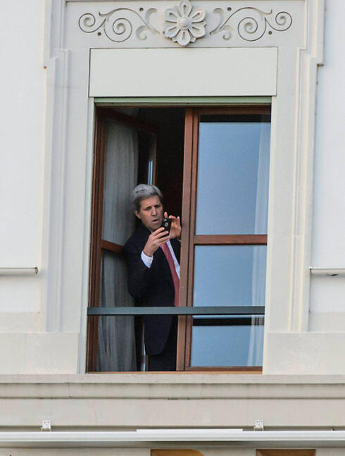 Kerry taking a Photo at the nuclear talks in Switzerland (Photo:EPA) (צילום: EPA) Kerry taking a Photo at the nuclear talks in Switzerland (Photo:EPA)