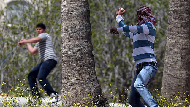 Stone throwers in Silwan (Photo: AFP)
