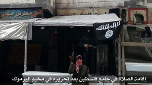 Islamic State flag flies in Yarmouk