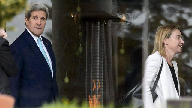 High Representative of European Union for Foreign Affairs Federica Mogherini and US Secretary of State John Kerry walk during a break in Lausanne (Photo: EPA) (EPA) High Representative of European Union for Foreign Affairs Federica Mogherini and US Secretary of State John Kerry walk during a break in Lausanne (Photo: EPA)