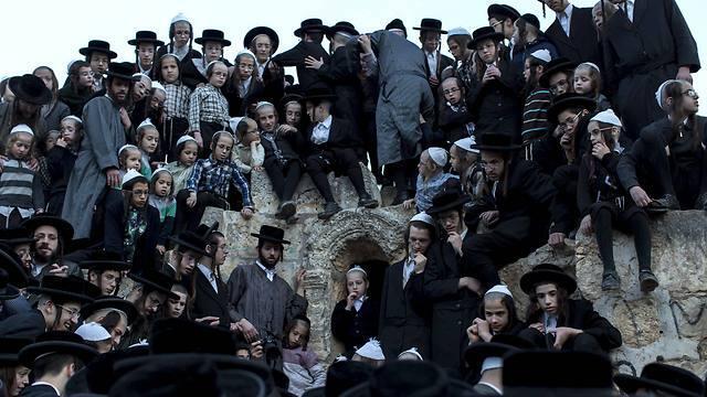 Ultra-Orthodox Jews of the Toldat Aharon sect gather on the ancient natural spring at Walaje in the West Bank in order to collect the spring water as it comes out from the mountain for matzoh (Photo: EPA) (EPA) Ultra-Orthodox Jews of the Toldat Aharon sect gather on the ancient natural spring at Walaje in the West Bank in order to collect the spring water as it comes out from the mountain for matzoh (Photo: EPA)