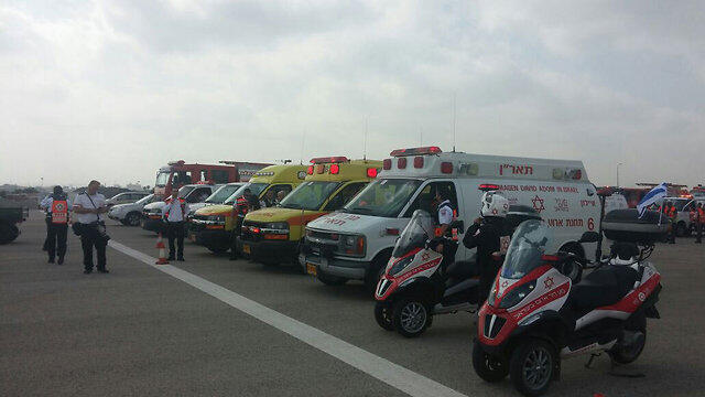 Magen David Adom paramedics waiting for the plane to land