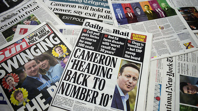 Friday morning's papers in Britain reporting on re-election of Prime Minister Cameron (Photo: AFP)