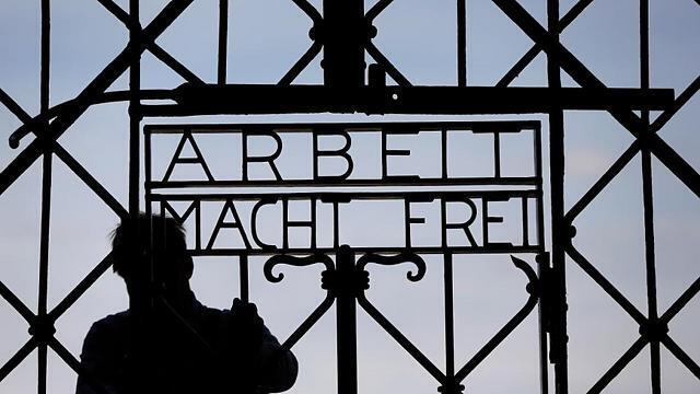 A blacksmith prepares a replica of the Dachau concentration camp gate at the main entrance of the memorial in Dachau (Photo: AP) (Associated Press) A blacksmith prepares a replica of the Dachau concentration camp gate at the main entrance of the memorial in Dachau (Photo: AP)