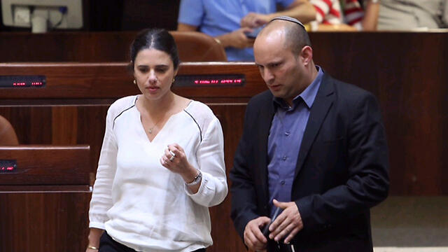 Bayit Yehudi Ministers Shaked (L) and Bennett will commence legislation next week to allow deporting migrants from Israel (צילום: גיל יוחנן) Bayit Yehudi Ministers Shaked (L) and Bennett will commence legislation next week to allow deporting migrants from Israel