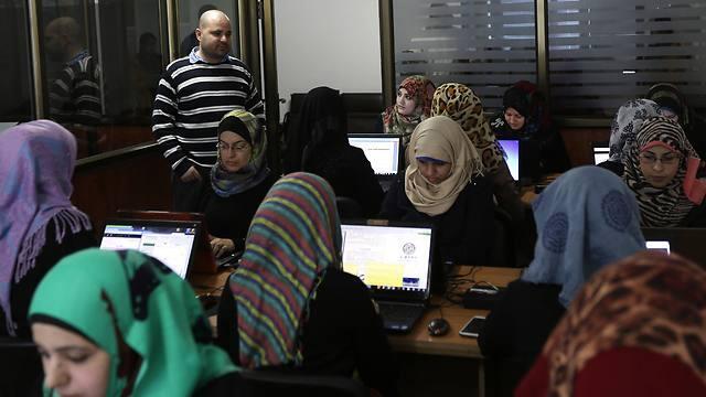 Women workers at socially responsible Gaza Strip start-up (Photo: AFP) (צילום: AFP) Women workers at socially responsible Gaza Strip start-up (Photo: AFP)