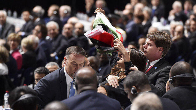 A pro-Palestinian protester interrupts Blatter's speech. (Photo: AFP)