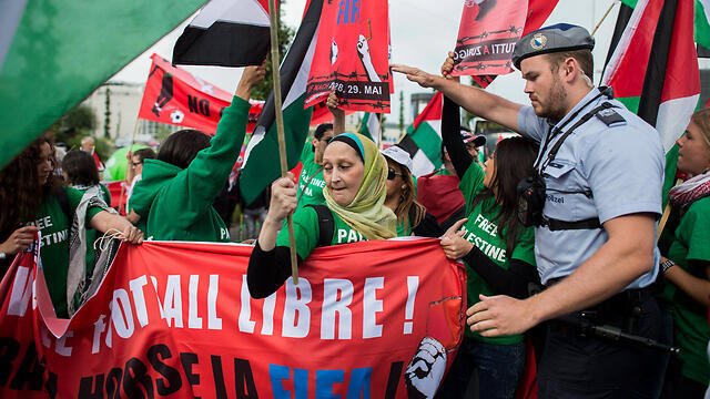 Pro-Palestinian supporters in Zurich, last week. The PR war waged by the PA and BDS is no longer limited to a game in the neighborhood soccer field (Photo: EPA)