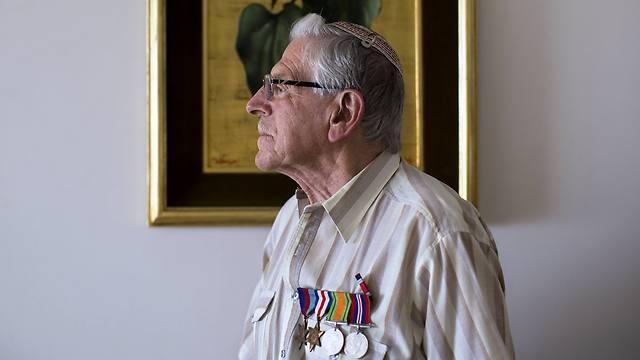 British Jewish World War II veteran Norman Cohen who landed on the beaches of Normandy on D-Day, poses for a photo at his home in Jerusalem (Photo: AP)