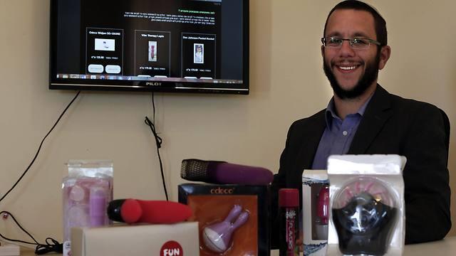 Natan Alexander poses in his office in Elazar in the West Bank with 'Kosher' sex toys (Photo: AFP) (AFP) Natan Alexander poses in his office in Elazar in the West Bank with 'Kosher' sex toys (Photo: AFP)