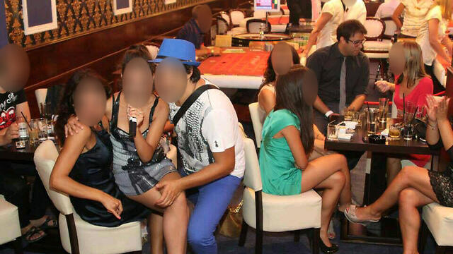 Hazan allegedly in the company of escorts at a Bulgaria casino.nullnull Hazan allegedly in the company of escorts at a Bulgaria casino.