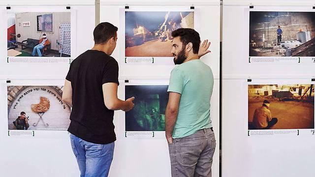 Alon Sahar (L) and Shay Davidovich, both former Israeli army soldiers, discuss in front of photographs at an exhibition of the Israeli NGO "Breaking the Silence" at the Kulturhaus Helferei in Zurich (Photo: AFP) (AFP) Alon Sahar (L) and Shay Davidovich, both former Israeli army soldiers, discuss in front of photographs at an exhibition of the Israeli NGO "Breaking the Silence" at the Kulturhaus Helferei in Zurich (Photo: AFP)