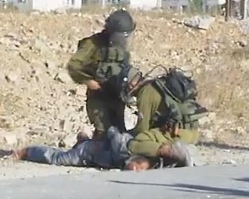 IDF soldiers arresting Palestinian demonstrator