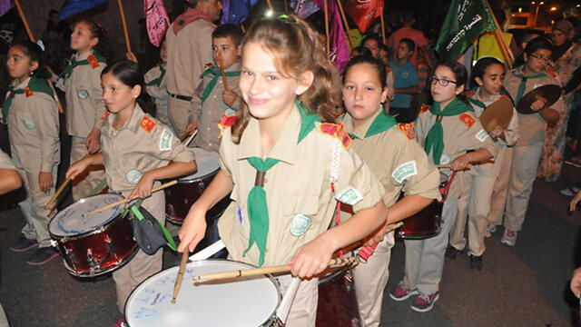 Youngsters play drums in the procession in Qalansawenullnull Youngsters play drums in the procession in Qalansawe