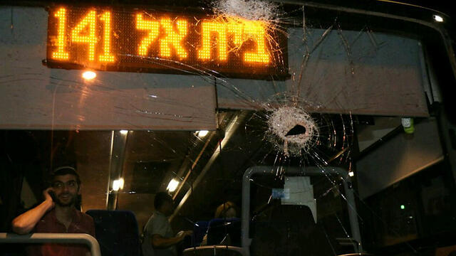 The bus damaged by rocks. (Photo: Tazpit News Agency)