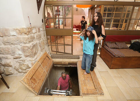 The family in their living room (Photo: Gil Yohanan)