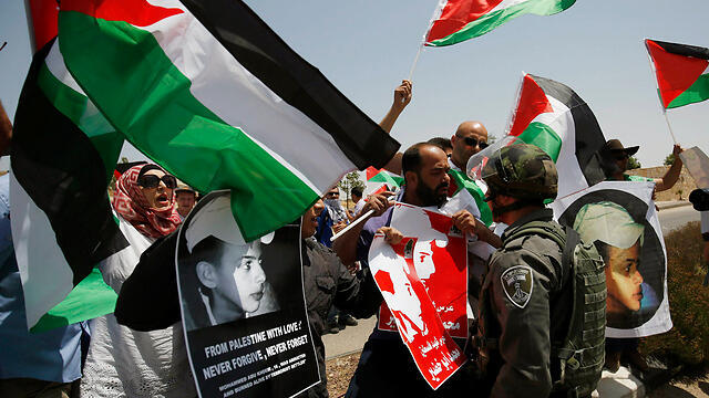 Protests in Ramallah on the one year anniversary of Aby Khdeir's murder (Photo: Reuters) (צילום: רויטרס) Protests in Ramallah on the one year anniversary of Aby Khdeir's murder (Photo: Reuters)