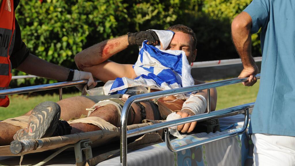 Michaeli wrapped in Israel flag while evacuated 