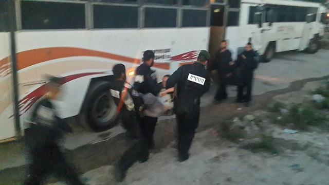 Youths being forcibly removed 