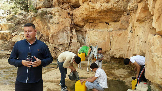 Rifat Mari said he had to walk a long way to a spring for waternullnull Rifat Mari said he had to walk a long way to a spring for water