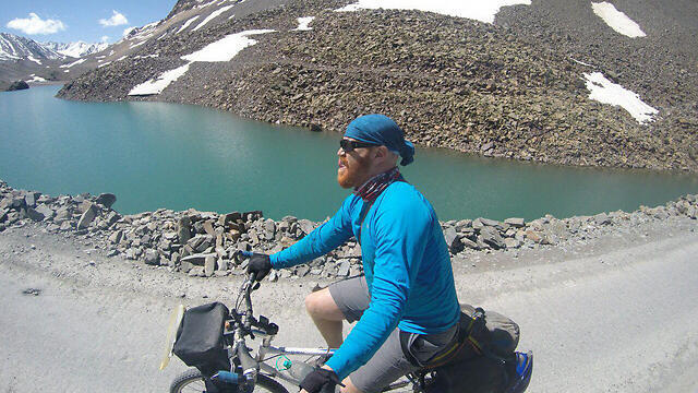 Sadan riding his bike in India