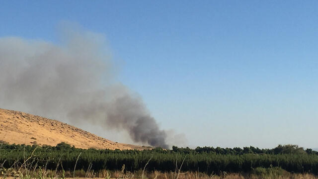 A fire at the site of yesterday's rocket strike. (Photo: Yuval Landov)