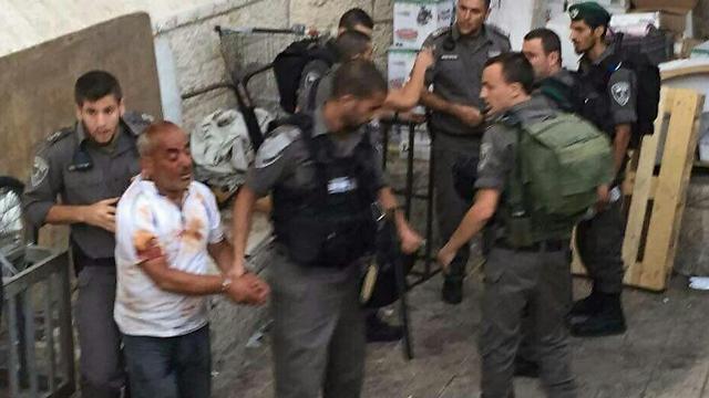 Attacker being led away by security forces