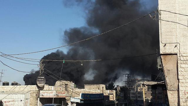 A fire started by firebombs thrown in the Shuafat neighborhood of East Jerusalem. (Photo: Hassan Shalaan)