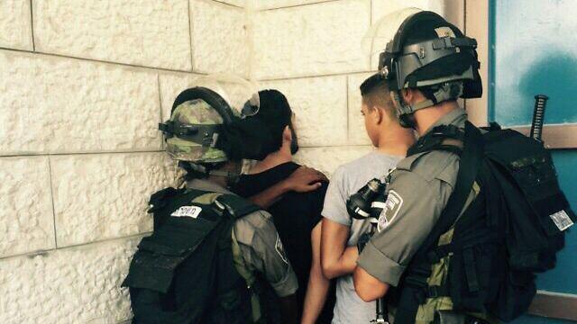Border Police arresting minors for throwing stones in Jabel Mukaber, East Jerusalem. (Photo: Police Spokesperson's Unit) (צילום: חטיבת דובר המשטרה) Border Police arresting minors for throwing stones in Jabel Mukaber, East Jerusalem. (Photo: Police Spokesperson's Unit)