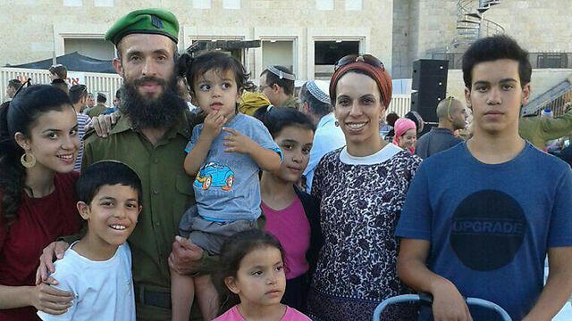 Lavi, his wife, and six of their children