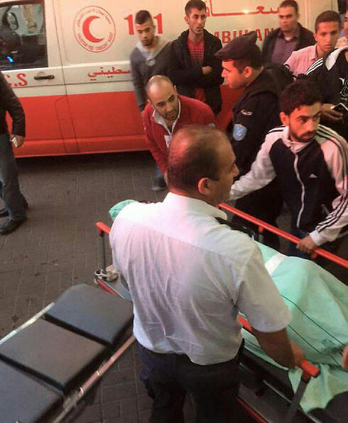  Palestinian casualty taken from the scene