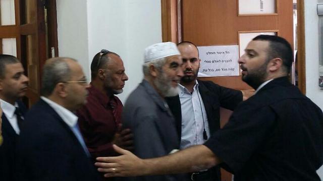 Salah arriving in court with MK Ahmad Tibi (Second from the left, wearing glasses). (Photo: Yael Freidson)