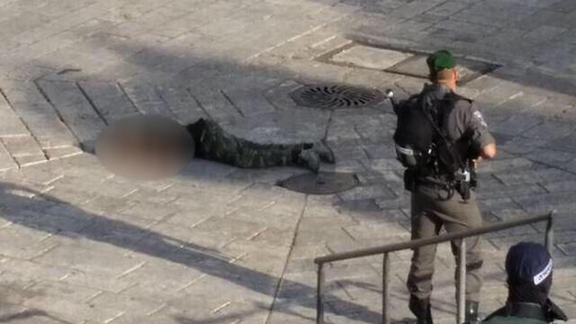 Terrorist on the ground after being shot.