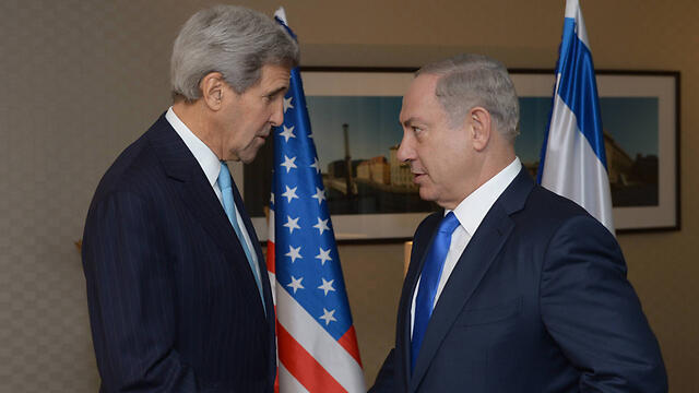 Kerry and Netanyahu meet in Berlin (Photo: GPO)