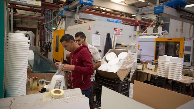 Palestinian workers at a factory in the Barkan Industrian Park (Photo: AFP)