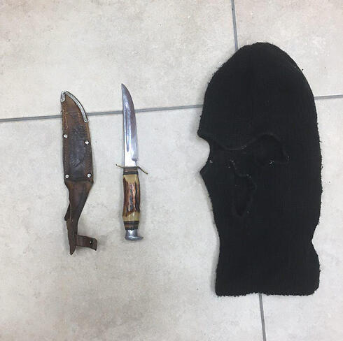 A knife and a ski mask found in the home of a youth suspected of attacking Rabbi Arik Ascherman. (Photo: Police Spokesperson's Unit) (צילום: חטיבת דובר המשטרה) A knife and a ski mask found in the home of a youth suspected of attacking Rabbi Arik Ascherman. (Photo: Police Spokesperson's Unit)