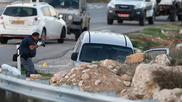 The scene of the attack on the Lipman family (Photo: AP) (צילום: AP) The scene of the attack on the Lipman family (Photo: AP)