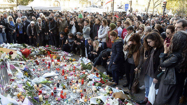 Mourners gather outside the Bataclan Theater, where the most victims died (Photo: AFP)