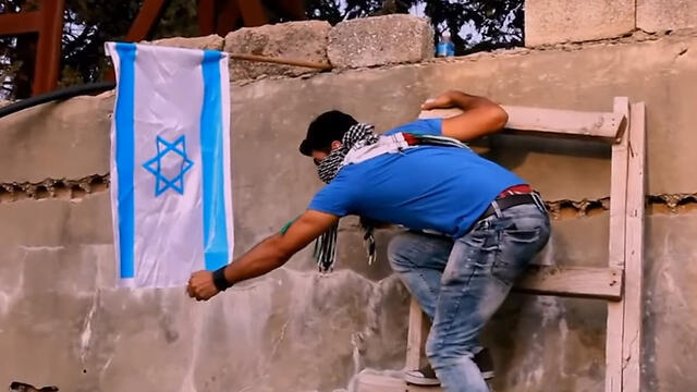 Still from Abu Kaf's inciteful video posted on Facebook 