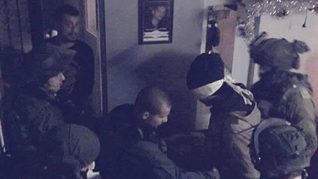 Troops arresting suspects in Qalandiya.nullnull Troops arresting suspects in Qalandiya.