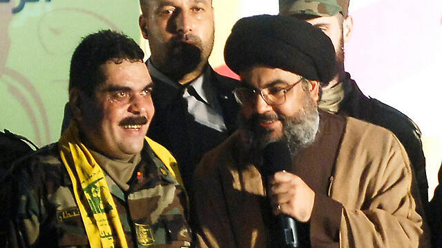 Kuntar with Hezbollah leader Nasrallah in Beirut in 2009 (Photo: AP) (צילום: AP) Kuntar with Hezbollah leader Nasrallah in Beirut in 2009 (Photo: AP)