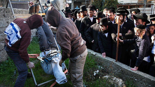 Protesters demonstrating the Duma suspects' alleged treatment. (Photo: AFP)