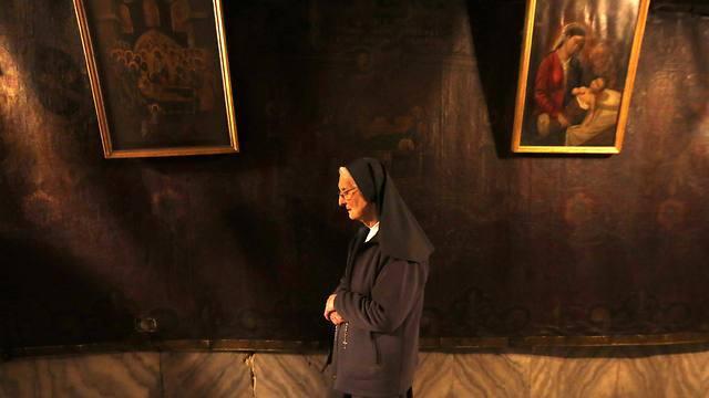 A Christian nun prays in the 'Grotto' of the Church of the Nativity (Photo: Reuters) (Reuters) A Christian nun prays in the 'Grotto' of the Church of the Nativity (Photo: Reuters)