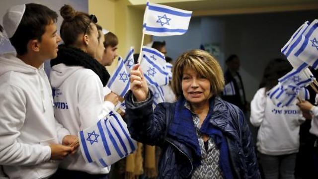 A Jewish immigrant from France arrives for a candle-lighting ceremony to mark Hanukkah, upon landing at Ben Gurion International Airport (Photo: Reuters) (Reuters) A Jewish immigrant from France arrives for a candle-lighting ceremony to mark Hanukkah, upon landing at Ben Gurion International Airport (Photo: Reuters)