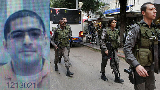 Nashat Melhem, left, and Border Police searching Tel Aviv (Photo: Reuters)